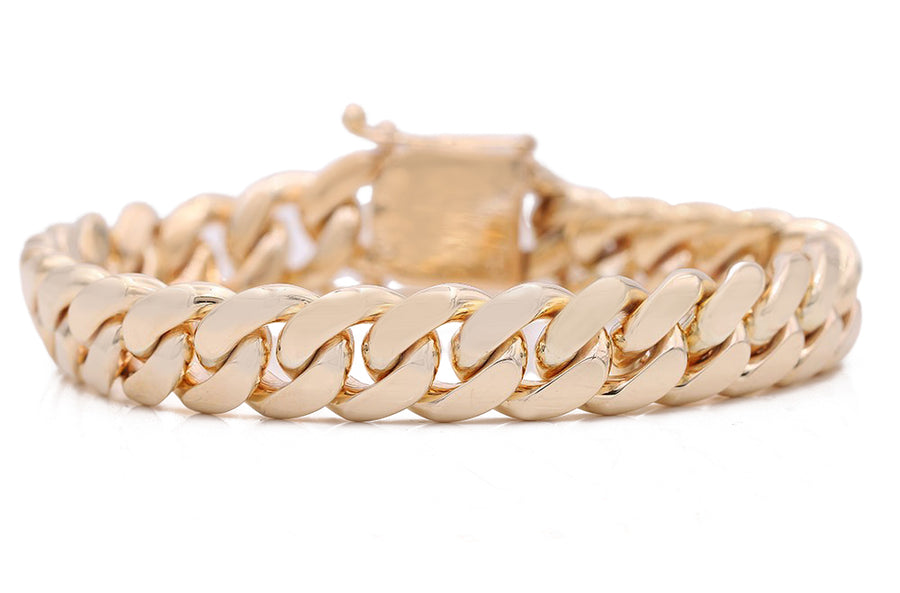 Men's 10K yellow gold Cuban link bracelet by Miral Jewelry.