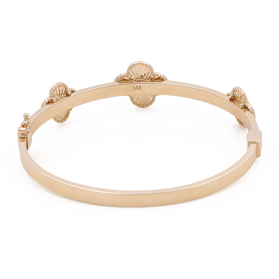 Miral Jewelry 14K Gold Fashion Flower Bracelet with four turtle-shaped accents, marked with "14k" on a white background.