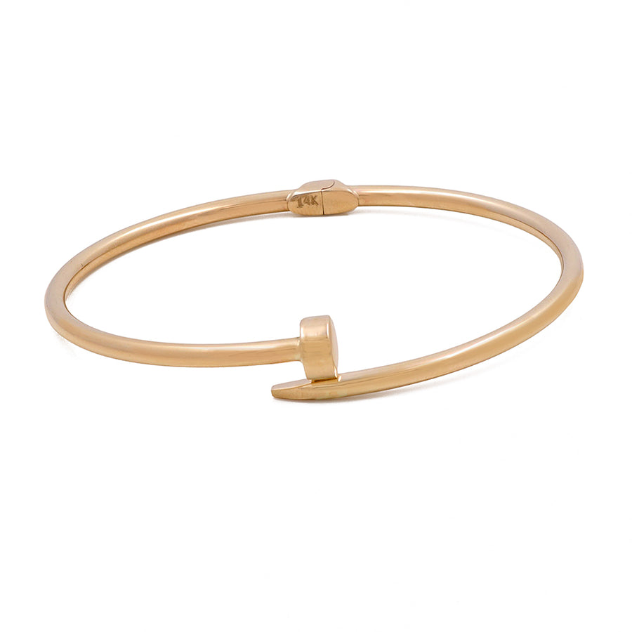 Miral Jewelry's 14K Gold Fashion Nail Bracelet with a nail head design on a white background.