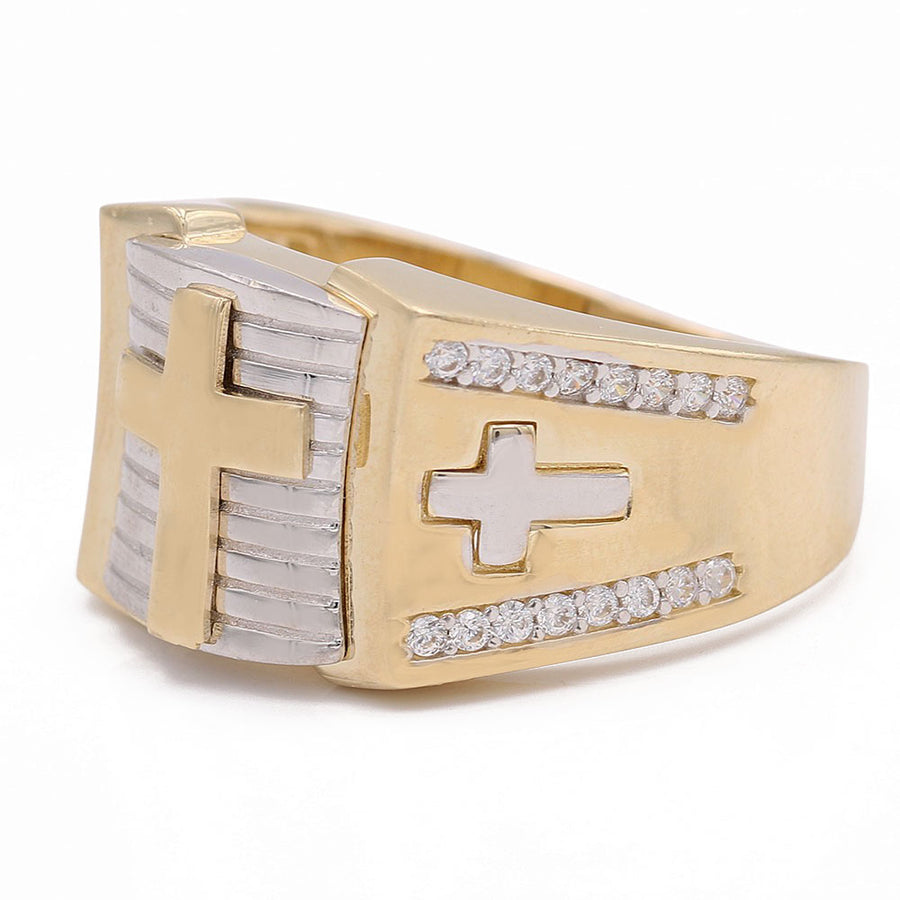 A Miral Jewelry 14K yellow gold cross ring adorned with diamonds.