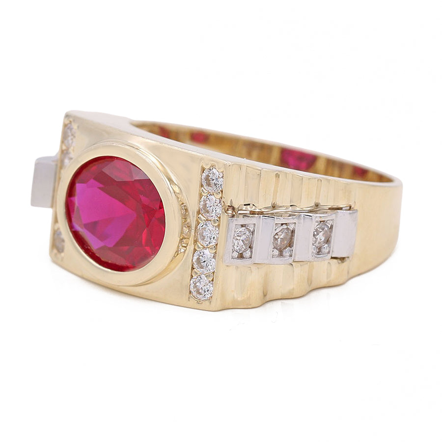 A Miral Jewelry men's fashion ring, crafted in yellow gold, showcasing a vibrant Red CZ surrounded by sparkling diamonds.