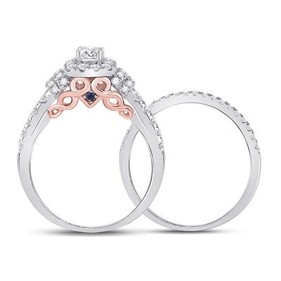 A white gold and pink diamond bridal ring set.