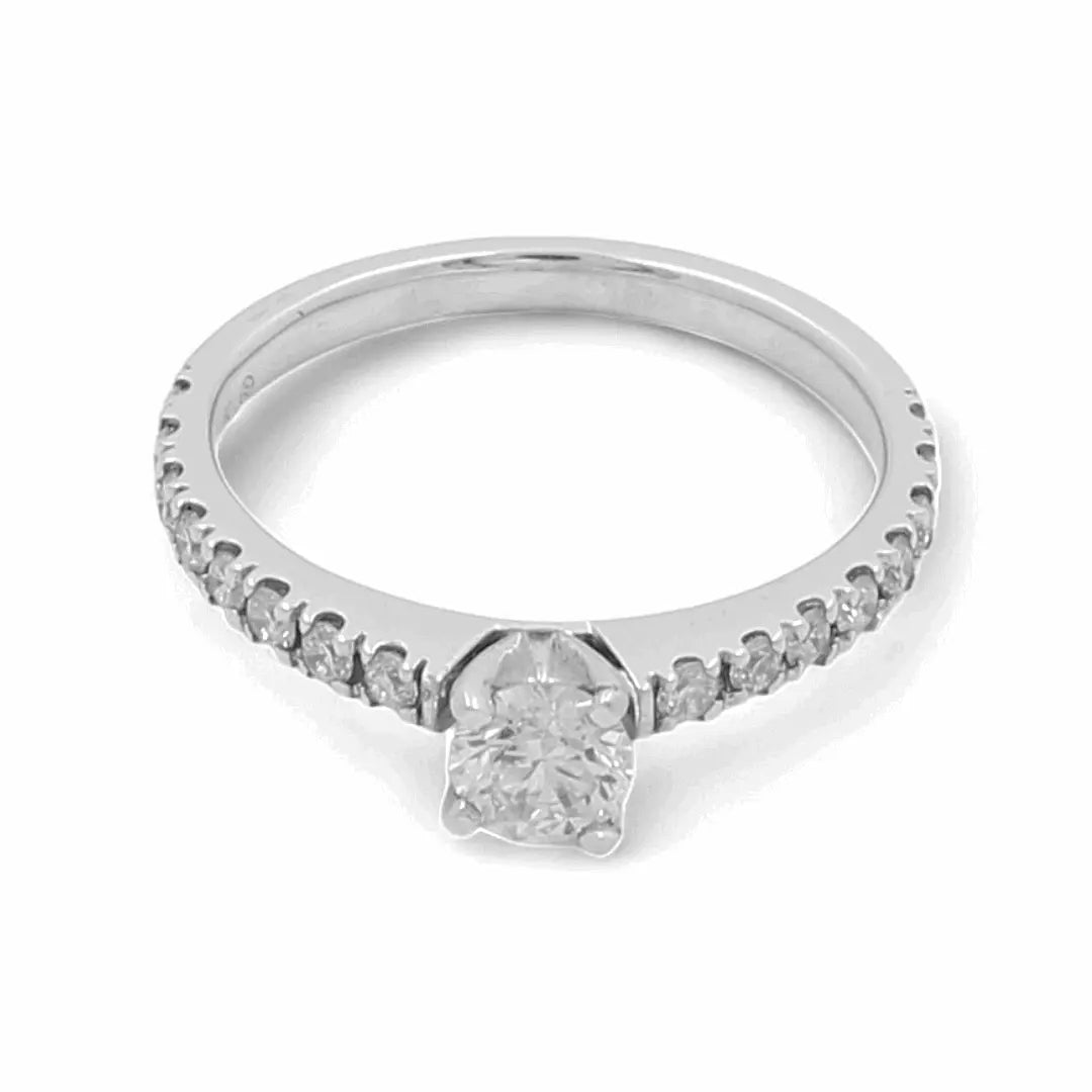 Introducing the Miral Jewelry 14K White Gold Bridal Woman's Ring with Diamonds, a breathtaking piece featuring a central round diamond beautifully complemented by smaller diamonds encrusted along the band.