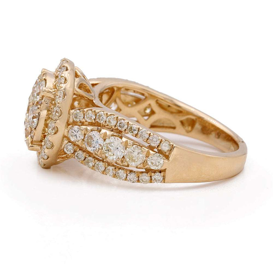 A Miral Jewelry 14K Yellow Gold Contemporary Engagement Ring with diamonds in the center and a 2.56tdw.