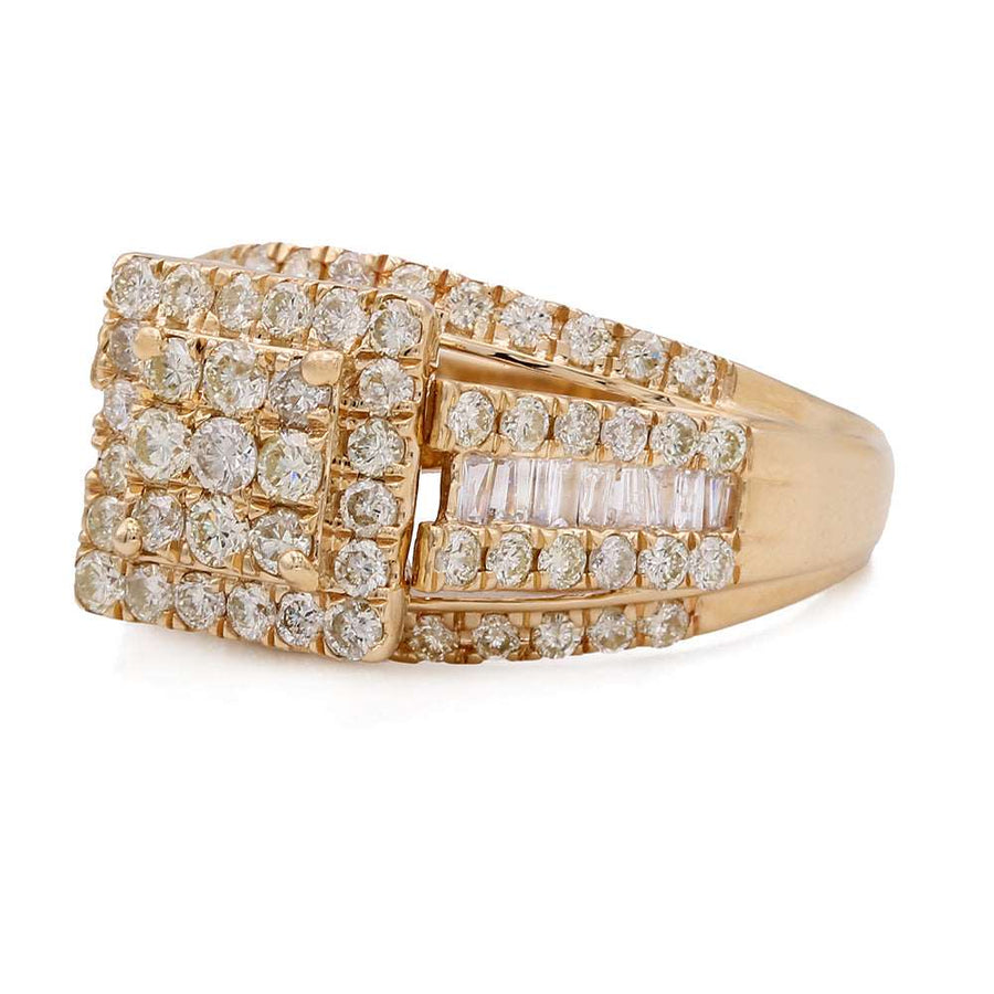 A Miral Jewelry contemporary engagement ring in 14K yellow gold featuring white diamonds.