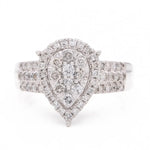 A Miral Jewelry contemporary engagement ring with a pear-shaped diamond set in 14K yellow gold.