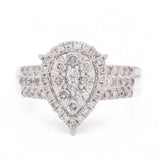 A Miral Jewelry contemporary engagement ring with a pear-shaped diamond set in 14K yellow gold.