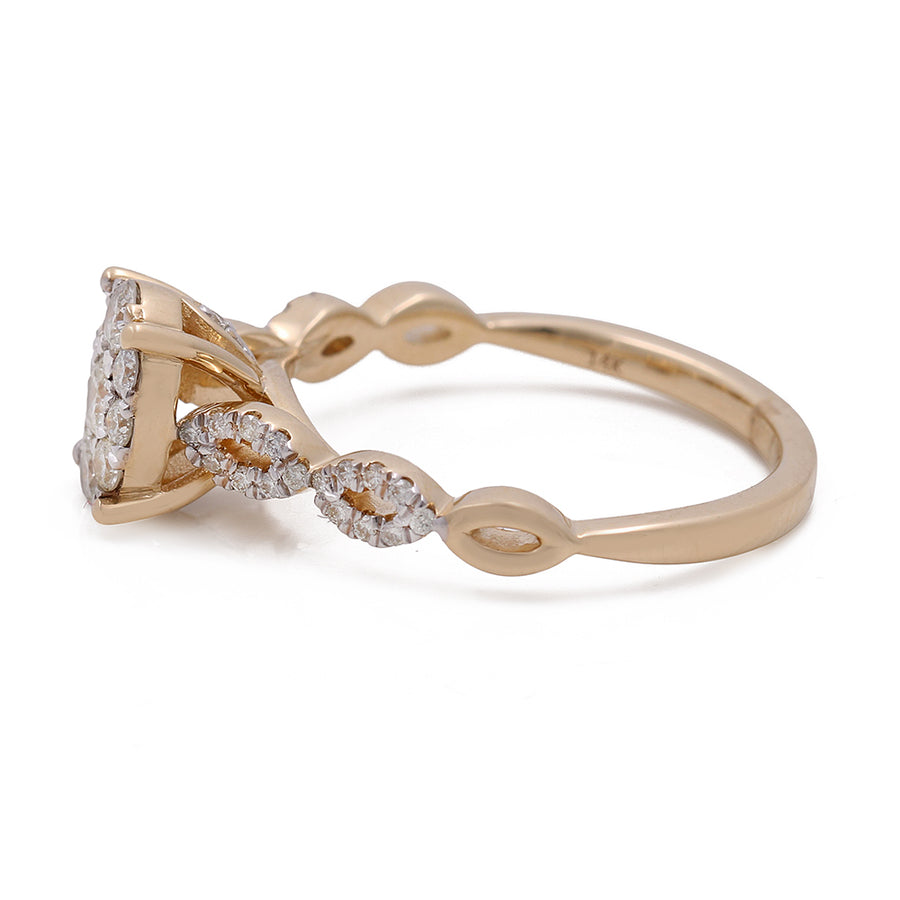 A Miral Jewelry 14K Yellow Gold Women's Contemporary Diamond Engagement Ring with 0.67 TW Round Diamonds.