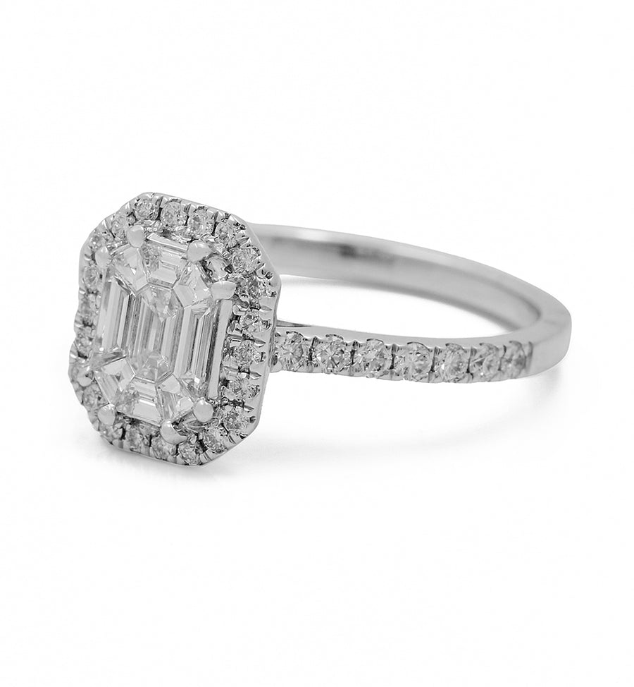A Miral Jewelry 14K White Gold Women's Contemporary Diamond Engagement Ring with 1.35 TW Round and Baguette Diamonds featuring an emerald cut diamond surrounded by a halo.