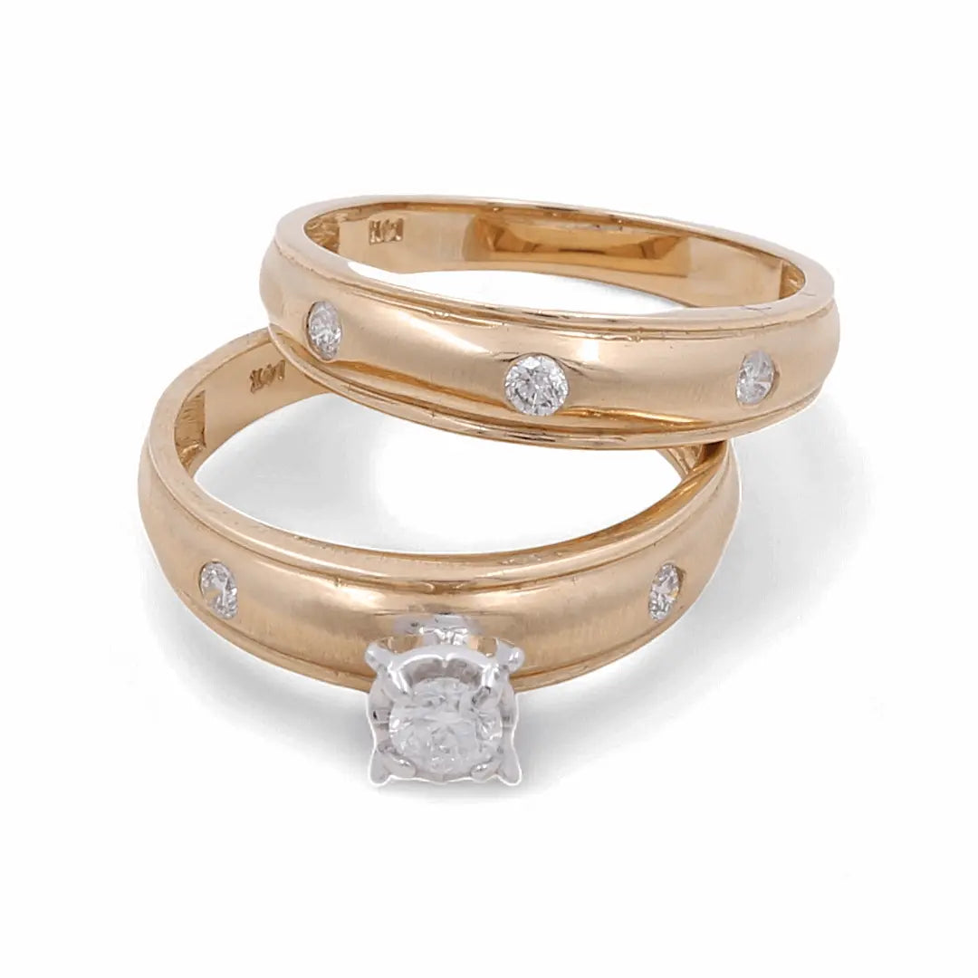 Two 14K Yellow Gold Bridal Woman Rings from Miral Jewelry are shown: one featuring a solitaire diamond in a prong setting, and the other adorned with five smaller diamonds embedded evenly around the band. Perfect as bridal jewelry.
