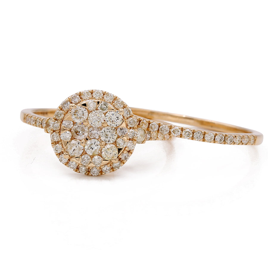 A contemporary engagement ring, set with a cluster of diamonds and crafted in 14K Yellow Gold by Miral Jewelry.