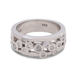 Presenting the Miral Jewelry 14K White Gold Woman Diamond Fashion Ring: This exquisite ring features multiple small round diamonds embedded in a scattered pattern across the silver-toned band. The inside of the band is marked "14K," signifying its high-quality craftsmanship. Perfect for a wedding ensemble, this ring exudes timeless elegance and sophisticated charm.