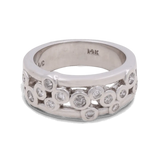 Presenting the Miral Jewelry 14K White Gold Woman Diamond Fashion Ring: This exquisite ring features multiple small round diamonds embedded in a scattered pattern across the silver-toned band. The inside of the band is marked "14K," signifying its high-quality craftsmanship. Perfect for a wedding ensemble, this ring exudes timeless elegance and sophisticated charm.