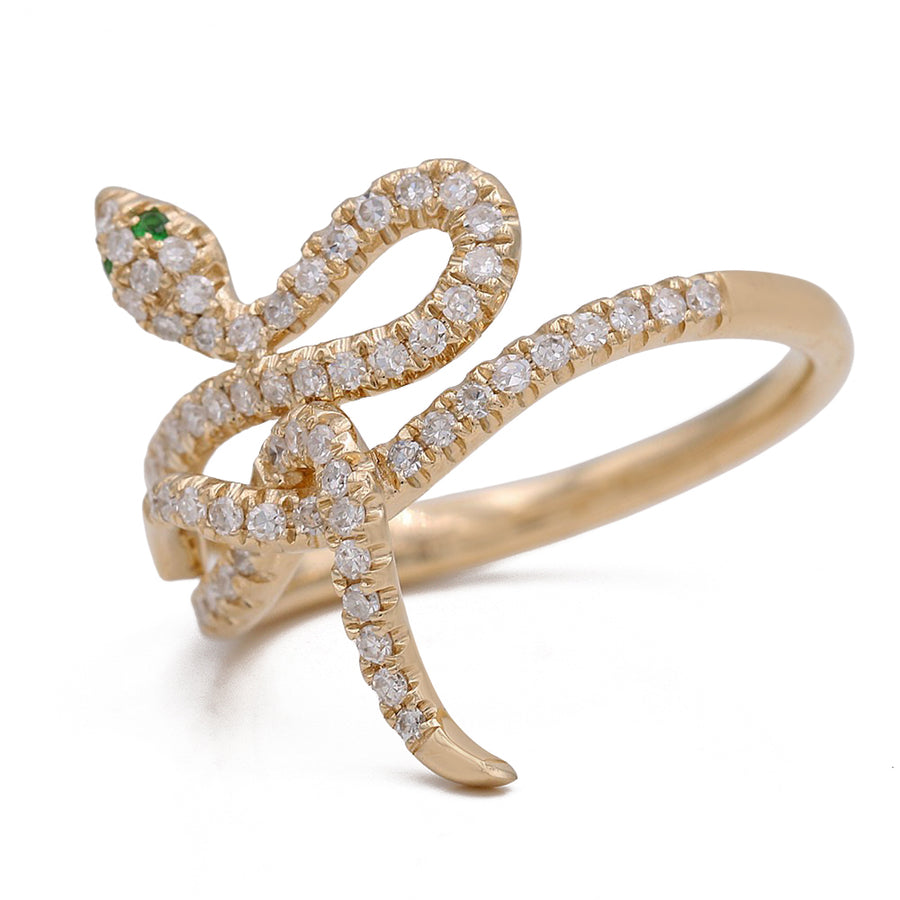 A stunning Miral Jewelry Yellow Gold 14K Snake Ring With Diamonds and Emeralds.