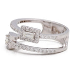 The Miral Jewelry Yellow Gold 14K Fashion Ring With Diamonds is a yellow gold 14K fashion ring with an open-band design adorned with small, rectangular baguette diamonds and encrusted with smaller round diamonds.