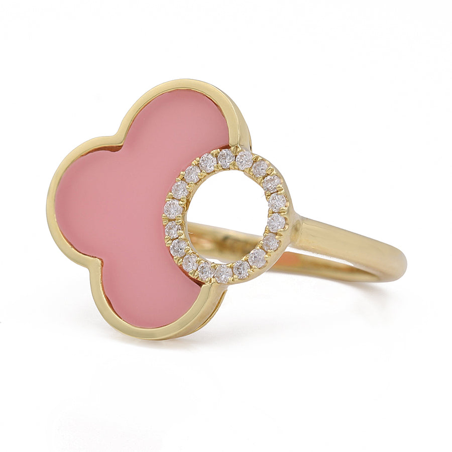 A Miral Jewelry Yellow Gold 14K Fashion Ring With Diamonds with pink enamel and diamonds set in yellow gold.