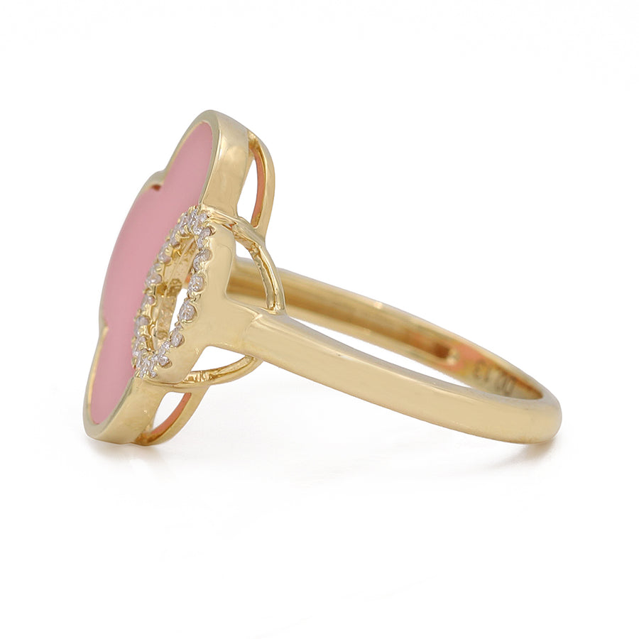 A Miral Jewelry yellow gold 14K fashion ring with diamonds and pink enamel, perfect for fashion-forward individuals.