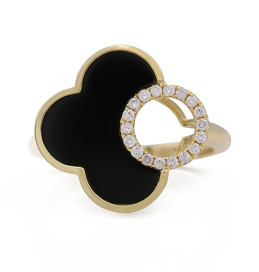 A Yellow Gold 14K Fashion Ring with Diamonds featuring a black onyx band adorned with Miral Jewelry diamonds.