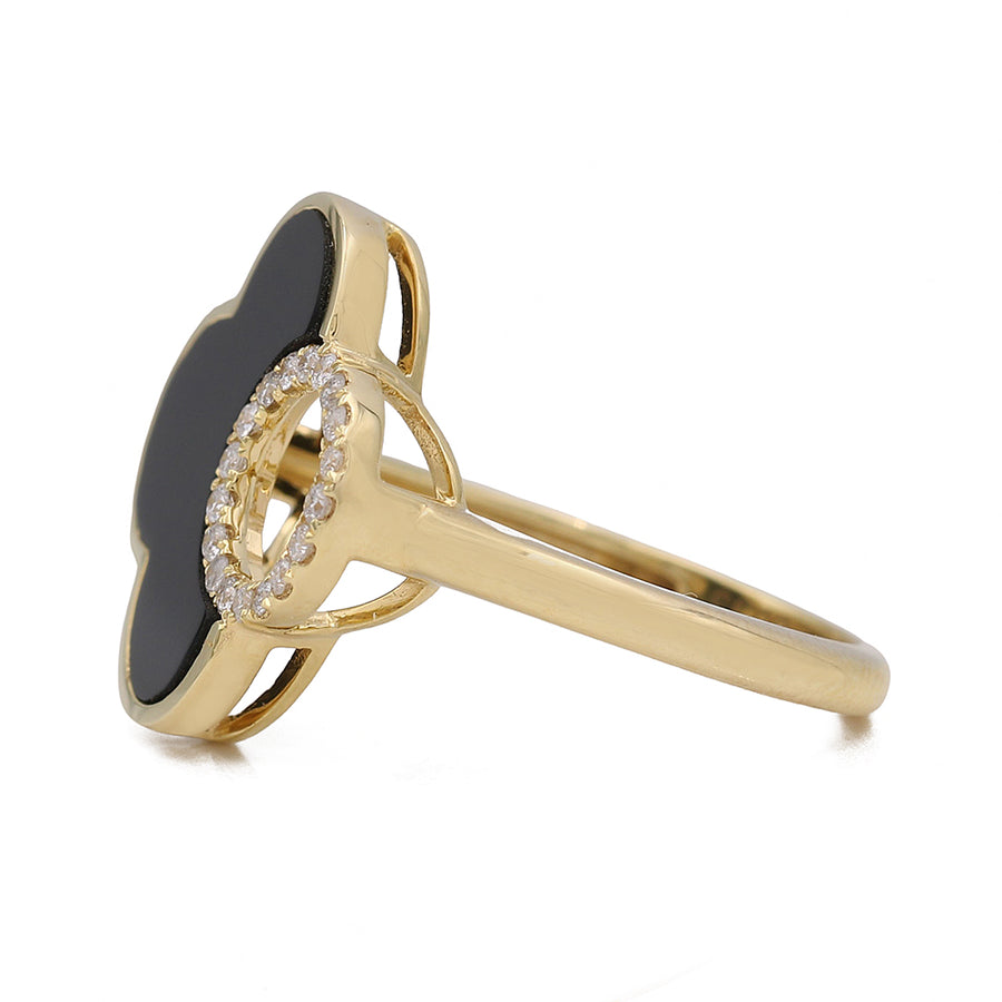 A **Yellow Gold 14K Fashion Ring With Diamonds** from **Miral Jewelry**, with a diamond-encrusted black clover, exuding elegance and style as a fashionable statement piece.