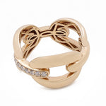 A Miral Jewelry 14k Yellow Gold Fashion Link Ring with 0.18Tw Round Diamonds featuring an intricate knot design and adorned with a band of small, round diamonds, this piece epitomizes luxurious jewelry.