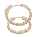 Close-up of the 14K Yellow Gold Hoops Earrings With 2.00Tw Round Diamonds by Miral Jewelry, adorned with sparkling round diamonds. Each earring is marked with "14K," indicating the gold purity, making it a timeless piece of jewelry.