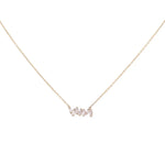 Introducing the 14K Yellow Gold Fashion Diamond Women Necklace by Miral Jewelry, a delicate piece featuring a gold chain with a pendant elegantly spelling "love" in cursive and adorned with small crystals. Crafted from 14K yellow gold, this exquisite necklace adds both charm and sophistication to your collection.