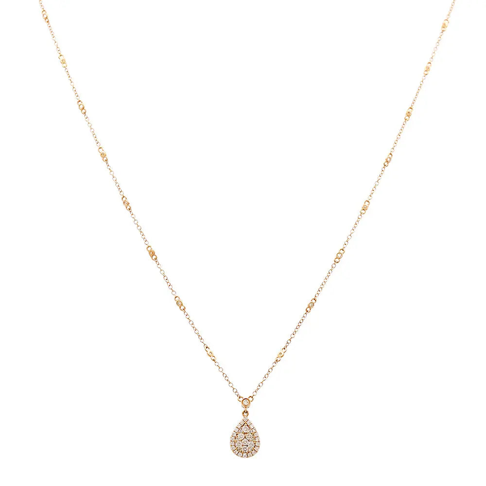 An elegant teardrop pendant hangs from a Miral Jewelry 14K yellow gold chain in this exquisite women's necklace.