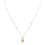 An elegant teardrop pendant hangs from a Miral Jewelry 14K yellow gold chain in this exquisite women's necklace.