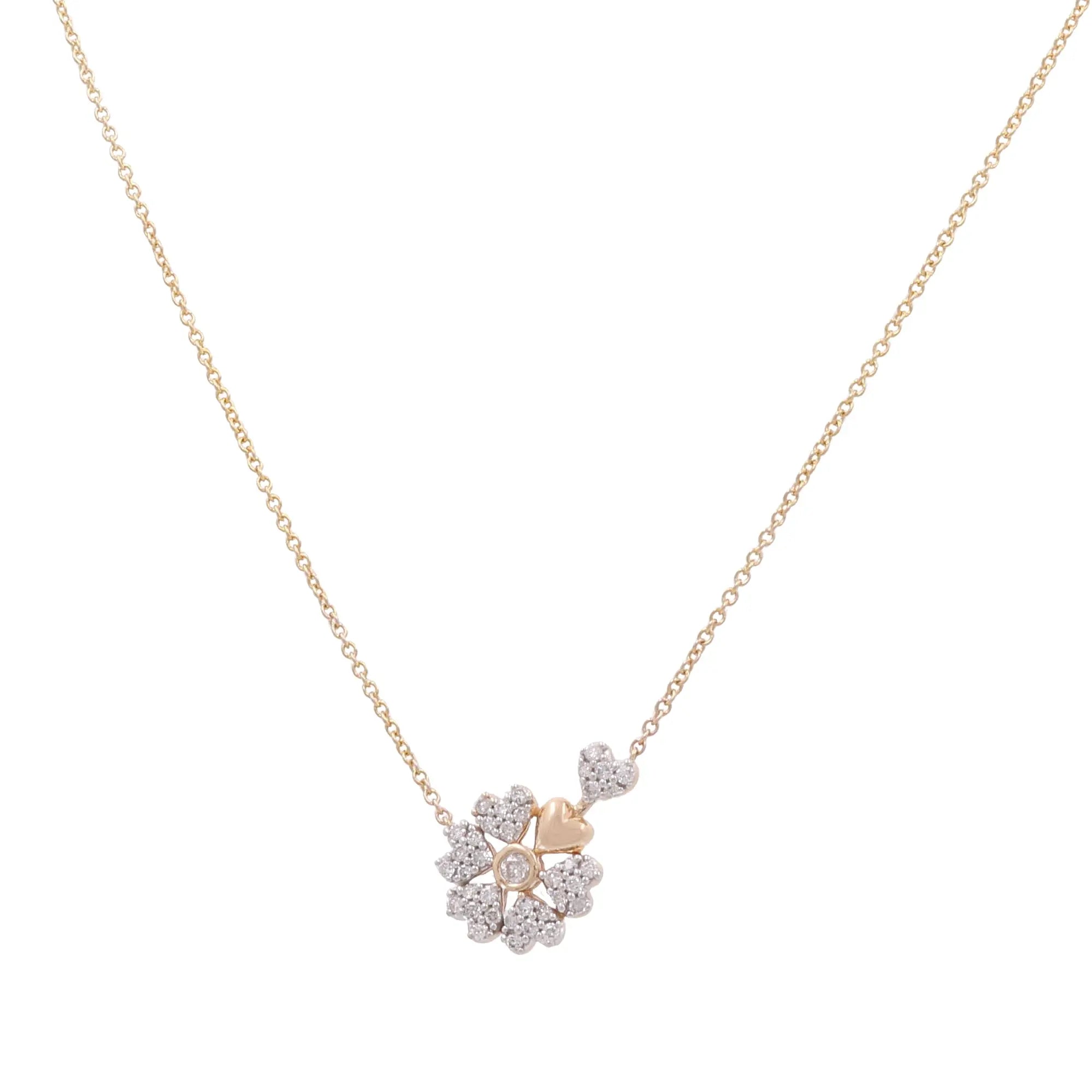 An elegant luxury jewelry piece from Miral Jewelry, the 10K Yellow Gold Fashion Diamond Women's Necklace features a pendant adorned with a cluster of small, sparkling diamonds in a captivating flower shape—ideal for any fashionable diamond women's necklace collection.