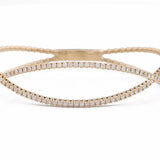 A Miral Jewelry Yellow Gold 14K Fancy Bangle Bracelet With Diamonds.