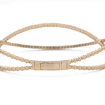 A Yellow Gold 14K Fancy Bangle Bracelet With Diamonds with a clasp by Miral Jewelry.