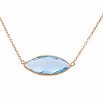 The Miral Jewelry 14K Yellow Gold Fashion Blue Topaz Women Necklace boasts a marquise-shaped blue topaz pendant elegantly set on a 14K yellow gold chain.