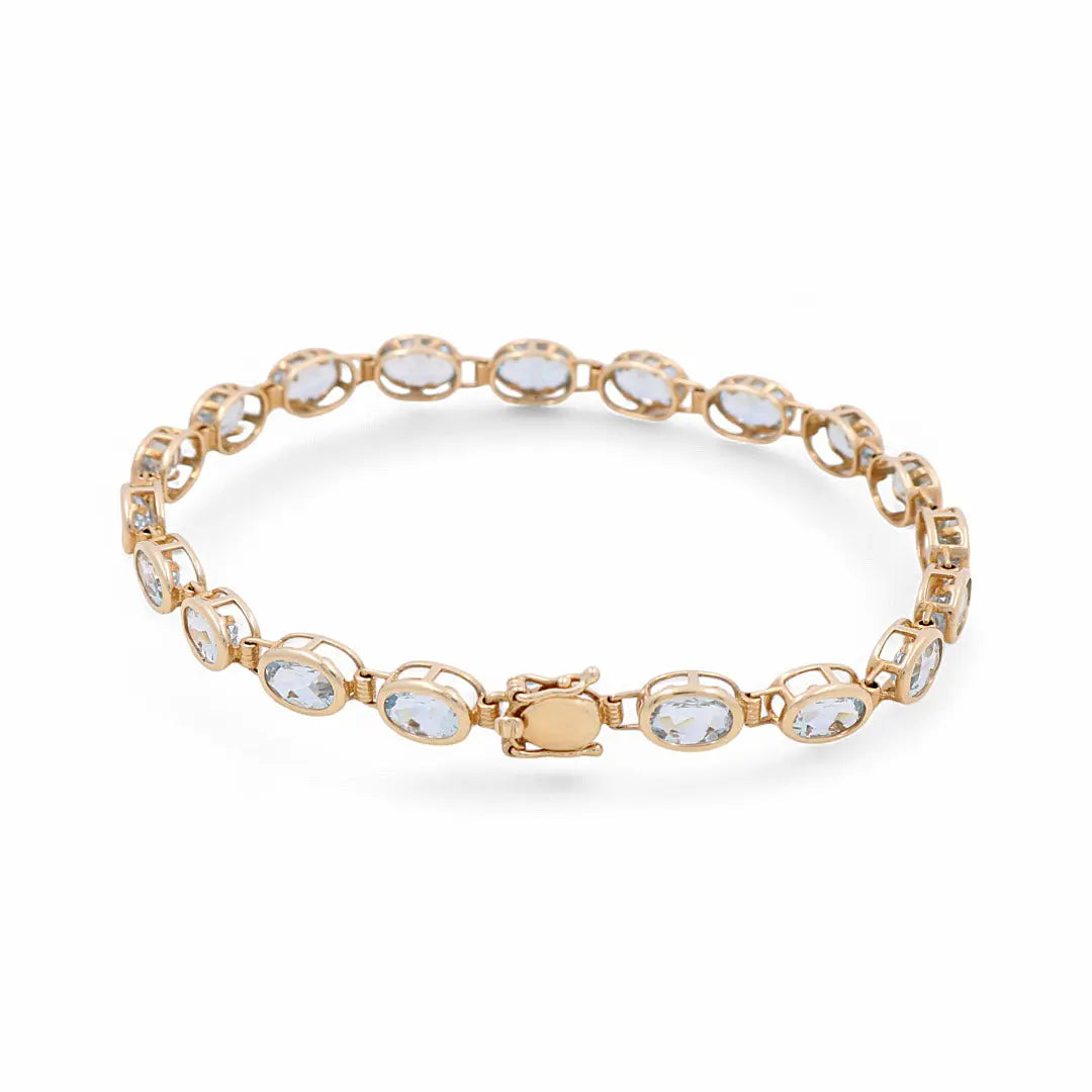 Introducing the Miral Jewelry's exquisite 14K yellow gold bracelet, adorned with a series of oval-shaped aqua stones and finished with a secure clasp closure.