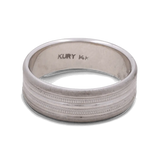 A Miral Jewelry 14K White Gold Wedding Men Ring, featuring a silver hue with an engraved design and the inscription "KURY 14K" inside the band.