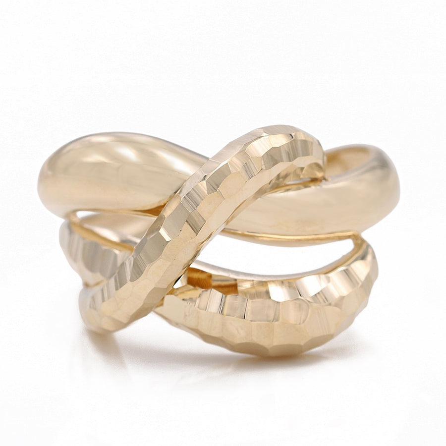 A timeless Miral Jewelry fashion ring made of 14K yellow gold with a twisted design.
