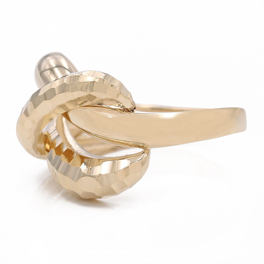 A timeless 14K Yellow Gold Smooth and Hammered Fashion Ring with a twisted design by Miral Jewelry.