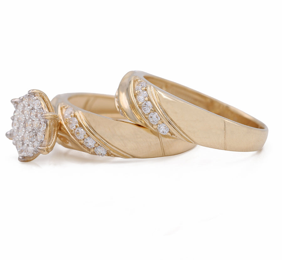 A Miral Jewelry Yellow Gold 14K Bridal Set adorned with diamonds and CZ stones.