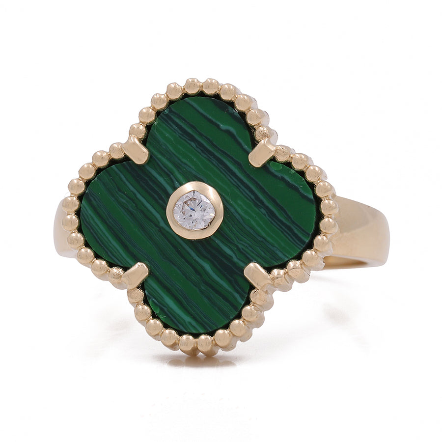 This stunning statement piece features a Women's Yellow Gold 14K Flower Ring With Malaquita Stone and Cz by Miral Jewelry, adorned with a green stone and diamonds, creating a timeless piece of jewelry.
