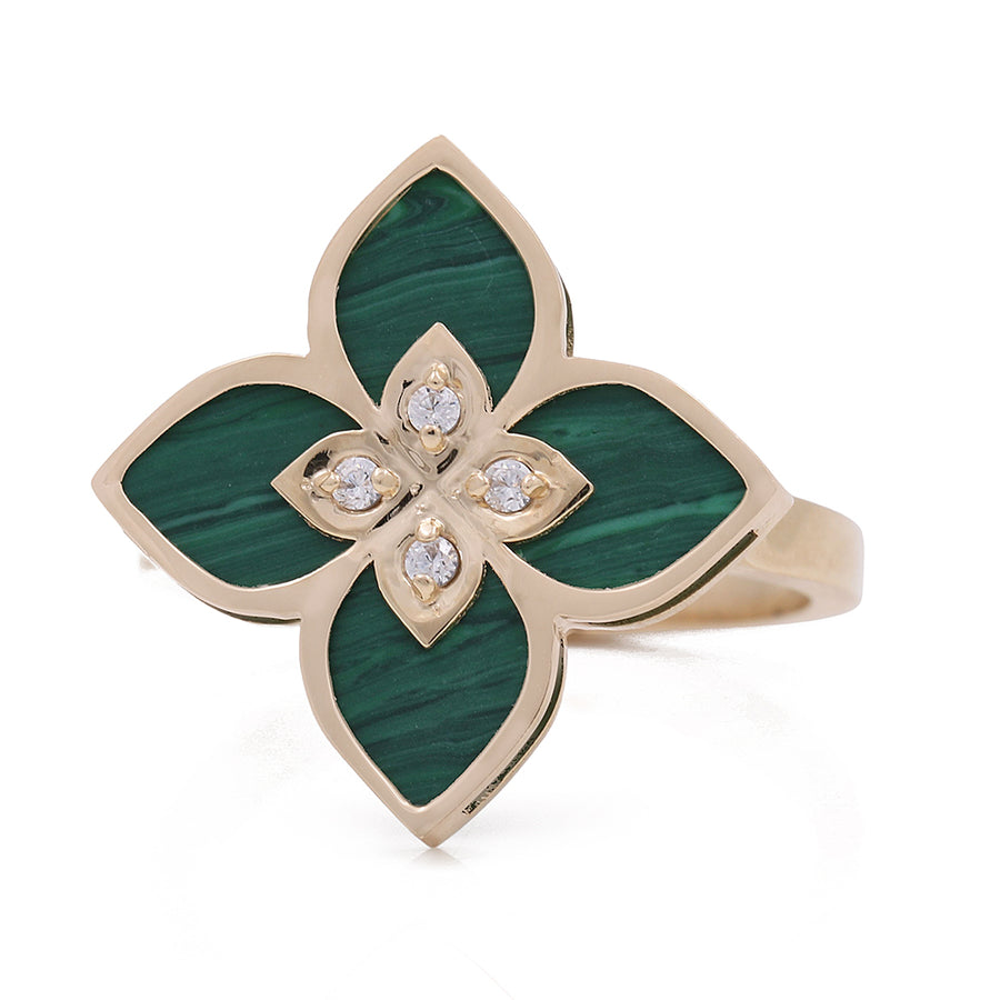 A statement fashion ring in Women's Yellow Gold 14K Flower Ring With Malaquita Stone and Cz from Miral Jewelry, adorned with an emerald green stone and encrusted with diamonds.