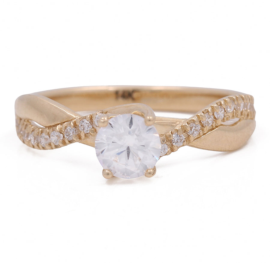 A Yellow Gold 14K Engagement Ring with Cz by Miral Jewelry, with a white diamond in the center.