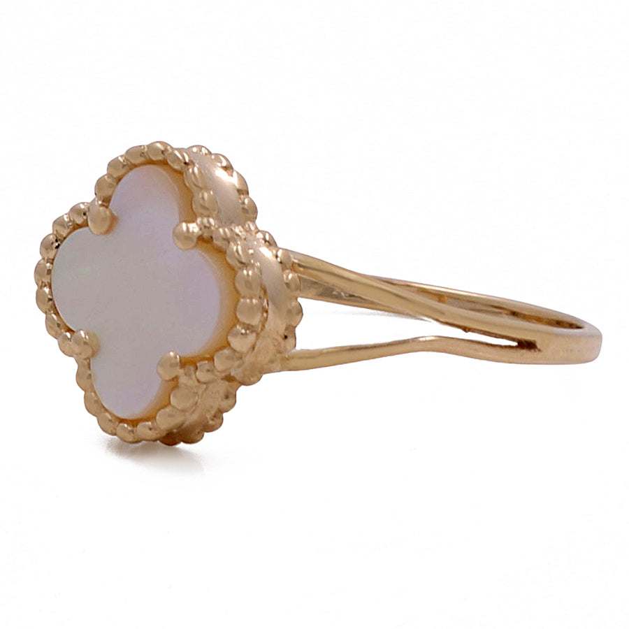 This elegant ring features Miral Jewelry's 14K Yellow Gold Fashion Flower Women's Mother of Pearl Ring.
