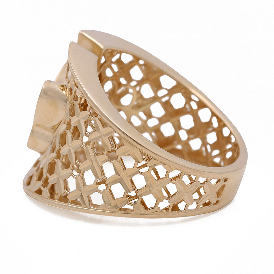 A Miral Jewelry women's fashion ring with an intricate butterfly design, crafted in 14K yellow gold, featuring Mother of Pearl.
