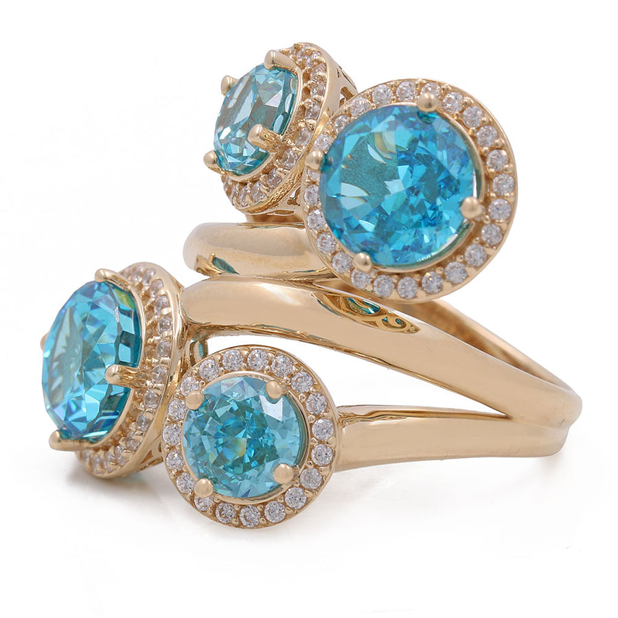 A Miral Jewelry yellow gold ring with blue topaz and diamonds.