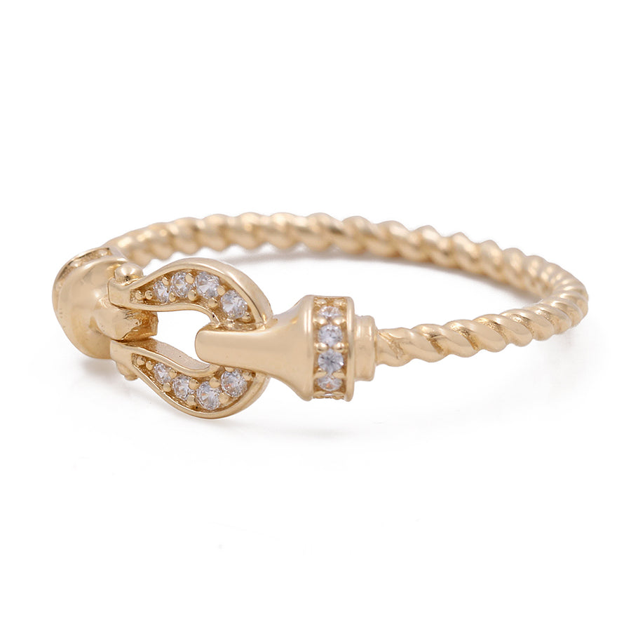 A Miral Jewelry 14K Yellow Gold Women's Fashion Loop Ring with Cubic Zirconias with diamonds on it.