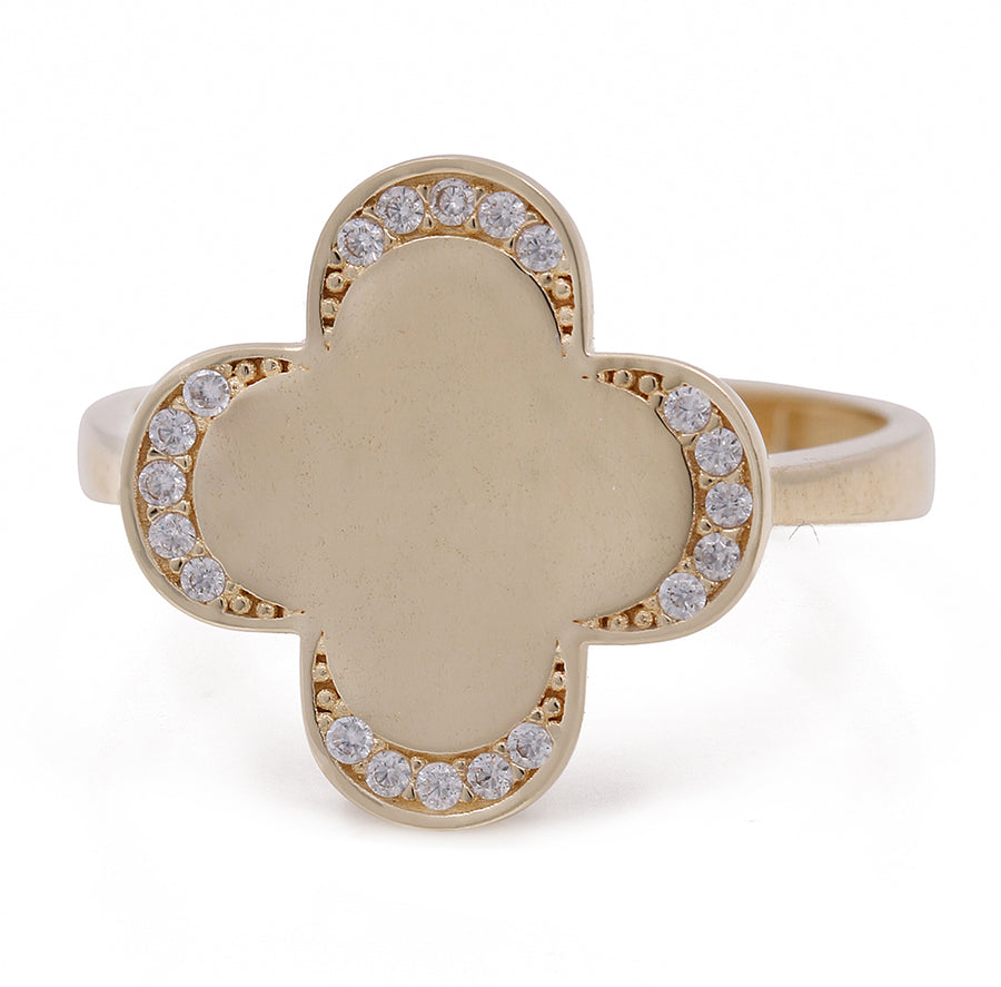 A Miral Jewelry 14K yellow gold women's fashion flower ring with cubic zirconias in the center.