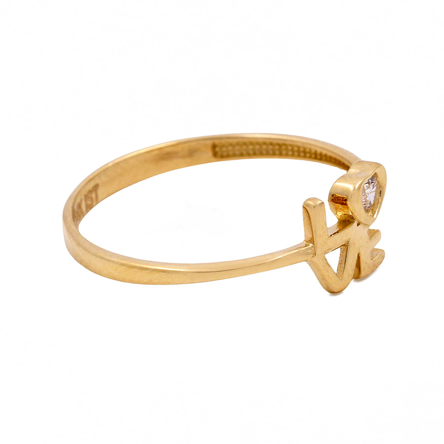Miral Jewelry's 14K Yellow Gold Fashion Love Women's Ring with Cubic Zirconias features a single Cubic Zirconias set in a prong setting with a star-shaped design.