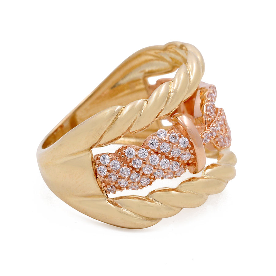 Miral Jewelry's 14K Yellow Gold Fashion Women's Ring with Cubic Zirconias features a rose gold twisted band and pavé cubic zirconias.