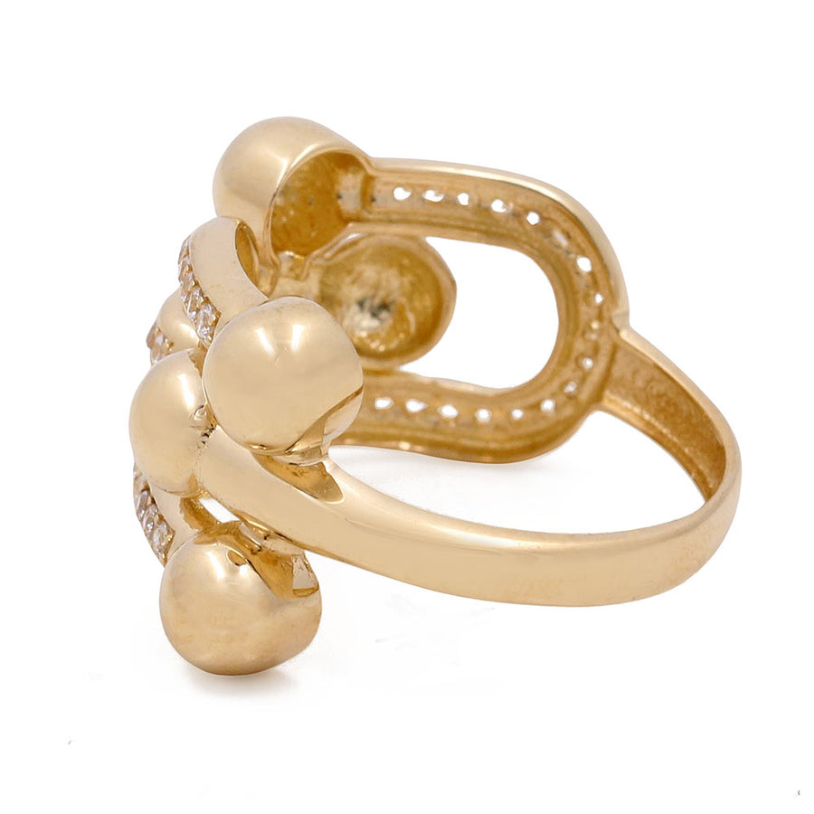 Miral Jewelry 14K Yellow Gold Fashion Women's Ring with Cubic Zirconias features spherical accents on a white background.