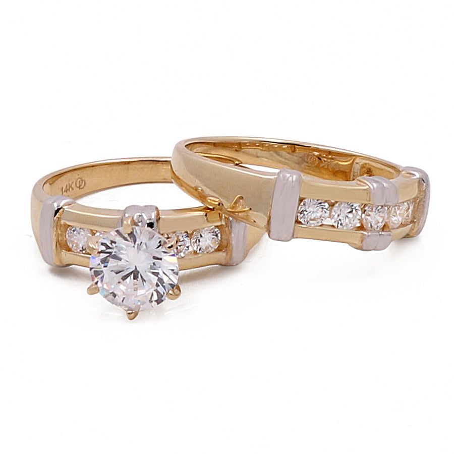 A pair of Miral Jewelry's 14K Yellow and White Gold Bridal Set with Cubic Zirconias.