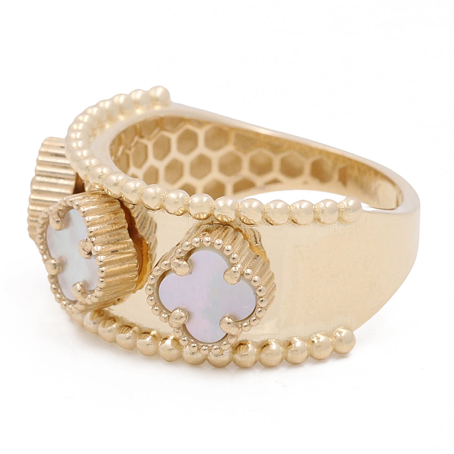Miral Jewelry's 14K Yellow Gold Mother of Pearl Flowers Ring features clover-shaped Mother of Pearl inlays and beaded detailing.